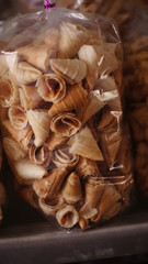 small ice cream cones in plastic wrap in the store