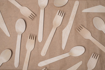 Top above overhead view photo of wooden cutlery isolated on craft paper background table