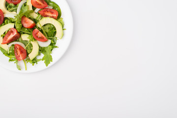 Healthy diet concept. Top above overhead close-up view photo of a salad plate with olive oil in the left top corner isolated on white background