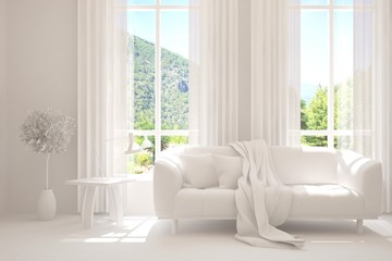 White living room with sofa and summer landscape in window. Scandinavian interior design. 3D illustration