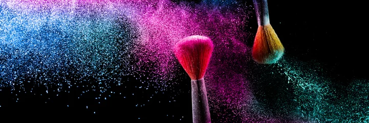 Poster Two brushes with pink and blue make up powder impact to make a colorful cloud. © Pattadis