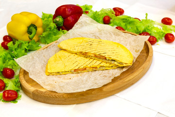 Quesadilla with cheese and meat on the table, fast food