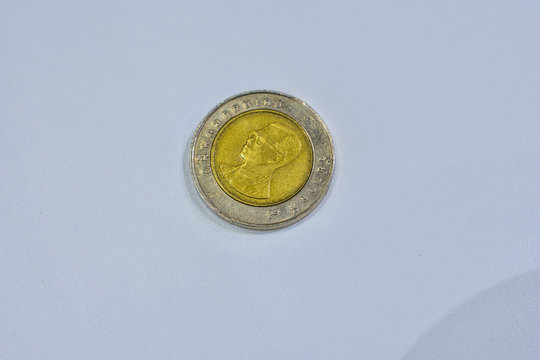 High Angle View Of Coin Against White Background