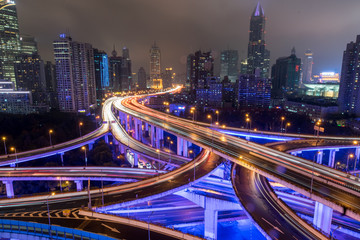 Fototapeta na wymiar Shanghai elevated road junction and interchange overpass at night in Shanghai, China