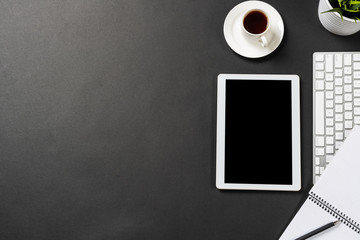 Top view of modern workplace with tablet computer