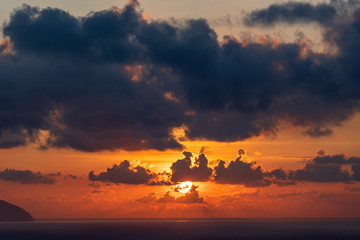 Landscape sunrise on Hon Chong cape, Nha Trang, Vietnam. Travel and nature concept. Morning sky, clouds, sun and sea water