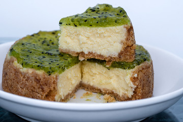 Cheese cake topped with kiwi fruit jam, closeup