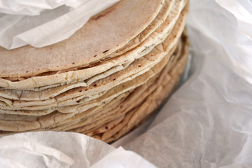 Mexican tortillas wrapped in white paper