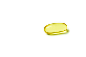 Yellow pill isolated on a white background