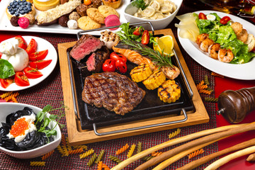 Roast beef, fried meat, meat dish with vegetables for lunch in a restaurant