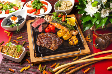 Roast beef, fried meat, meat dish with vegetables for lunch in a restaurant