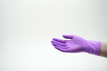 Medical, latex, nitrile glove of lilac color on a white background.