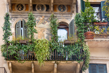 Fototapeta na wymiar Case dei Mazzanti with its facade frescoes. Details of the facade. Piazza delle Erbe, Verona, Veneto, northern Italy, Europe - march 9, 2016