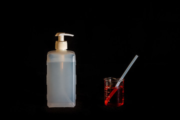 Corona virus prevention hand sanitizer gel in bottle. Hand disinfectant gel isolated on Black background