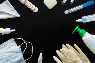 various medical and household hygiene items on a black background. Medicines on table top view....