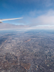 Fototapeta na wymiar A distant city seen from an aeroplanes window.