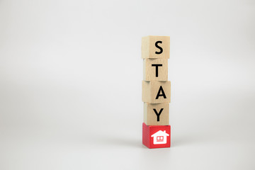 Stay home Stay safe icons on wooden toy block.Concepts for health and medical prevention of coronavirus or Covid-19 infection, Social Distancing and work from home.