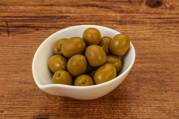 Green pickled olives in the bowl