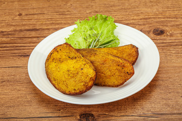 Baked potato with herbs and spices