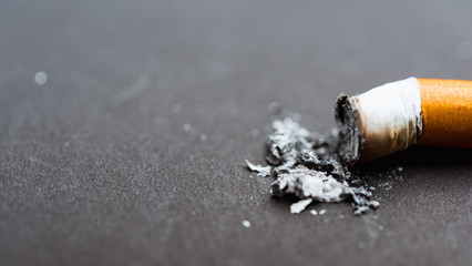 31 May of World No Tobacco Day, no smoking, close up of broken pile pin down cigarette or tobacco on black background with copy space, and Warning lung health concept