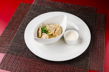 Dumplings, manti cooked dish in a restaurant