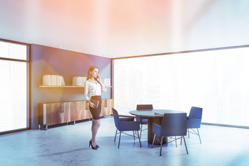 Woman in blue home library