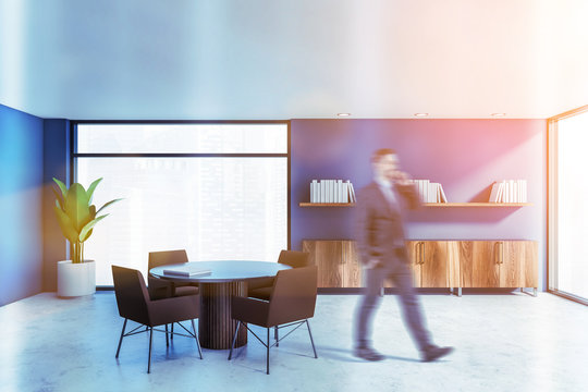 Man Walking In Blue Home Library