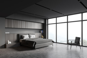 Panoramic gray bedroom with armchair