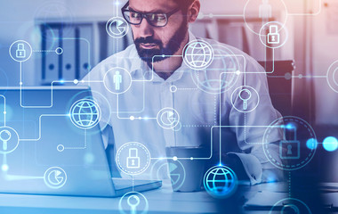 Bearded man with laptop, online business interface