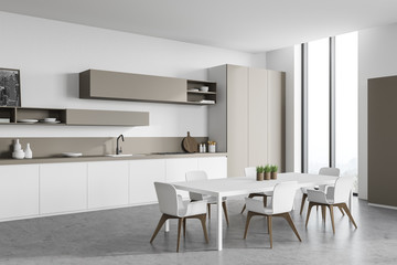 White and beige kitchen corner with table