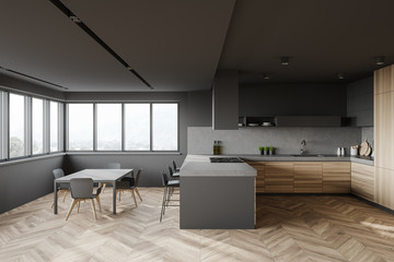 Gray and wood kitchen interior with bar and table