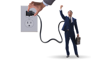 Businessman being powered by electricity and plug