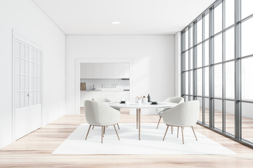 White dining room and kitchen