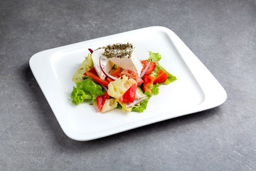 Vegetable and meat salad, classic salad for lunch in a restaurant