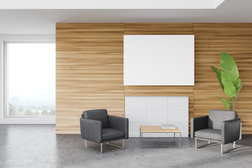 Wooden office waiting room, armchairs and poster