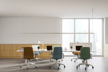 Wooden office interior with colorful chairs