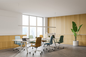 Wooden office corner with colorful chairs