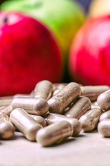 Capsules made with natural products such as fruits. Macrobiotic product concept.