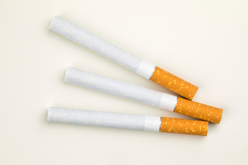 Close up of a smoking cigarettes on white