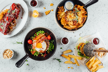 Top view on Pub food table, different foods on table,Flat lay meals at Irish pub
