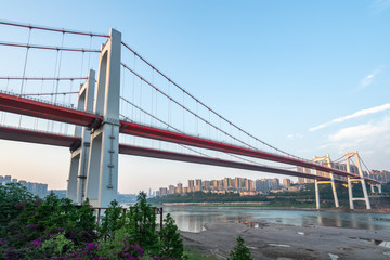 Two red suspension bridges on the Yangtze River in Chongqing, China