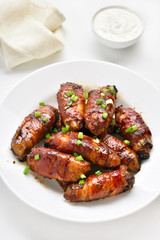 Bacon wrapped grilled chicken wings