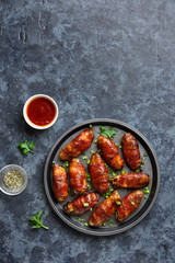 Bacon wrapped grilled chicken wings