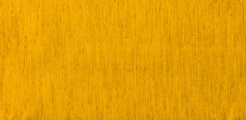 The brilliance of a sparkling yellow canvas lit by the sun at a spring day as a decorative background