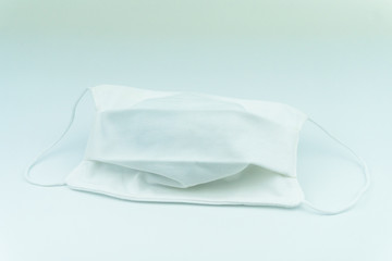 white surgical or medical mask on white background for protection covid-19 or coronavurus and air polution
