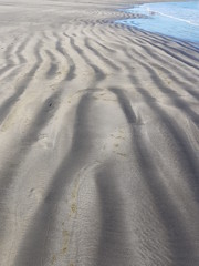 Footprints in the sand, Tenerife beach in Spain