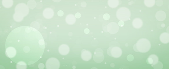 Glowing green circles.  Spring concept.  Blurred bokeh circles.  Website banner.  Celebration.