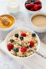 Oatmeal with berries for breakfast in a bowl