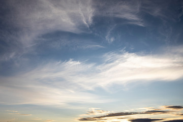 beautiful fluffy clouds in the light of morning sun