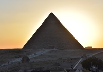 beauty  sunset background of pyramids giza  CAIRO EGYPT.Silhouette pyramids when sunset and orange...
